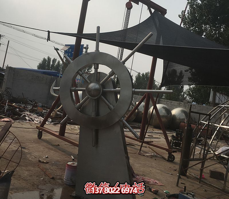 騰飛不銹鋼雕塑船舵，點(diǎn)綴室內(nèi)飯店